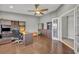 Home office with built in desk and shelves featuring dark trim, storage, and a view of the water at 7801 Georgeann St, Winter Park, FL 32792