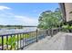 Relax on this patio with a pool and water view offering great sun coverage and a beautiful view at 7801 Georgeann St, Winter Park, FL 32792