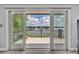 Enjoy stunning lake views from the sliding glass doors leading to the outdoor patio at 7801 Georgeann St, Winter Park, FL 32792