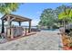 Outdoor living at its finest with a luxurious pool and a charming gazebo overlooking the lake at 7801 Georgeann St, Winter Park, FL 32792