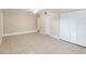 Spacious bedroom with tile flooring, ceiling fan, and a double door closet at 8111 Esperanza St, Orlando, FL 32817