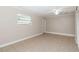 Neutral bedroom with tile floor and ample natural light from the large window at 8111 Esperanza St, Orlando, FL 32817