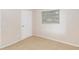 This bedroom features tile floors, a window with blinds, and fresh paint at 8111 Esperanza St, Orlando, FL 32817