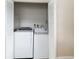 Laundry closet featuring a washing machine and a dryer at 8111 Esperanza St, Orlando, FL 32817