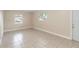 Open living area featuring tile floors, a fresh coat of paint, and natural light at 8111 Esperanza St, Orlando, FL 32817