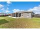 Enjoy the outdoors in this backyard, complete with a screened-in porch and lush lawn at 906 Highland Crest Cir, Lake Wales, FL 33853