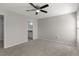 Bright and airy bedroom includes neutral carpet, ceiling fan, and natural light at 906 Highland Crest Cir, Lake Wales, FL 33853