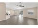 Bright and spacious living room featuring tile floors, a ceiling fan, and sliding doors to the backyard at 906 Highland Crest Cir, Lake Wales, FL 33853