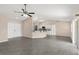Open living space with a ceiling fan, and breakfast bar perfect for casual dining and entertaining at 906 Highland Crest Cir, Lake Wales, FL 33853