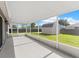 Relaxing screened patio offering views of the backyard and a storage shed at 906 Highland Crest Cir, Lake Wales, FL 33853