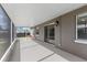 Screened in lanai, perfect for outdoor living, featuring sliding glass doors to the home's interior at 906 Highland Crest Cir, Lake Wales, FL 33853