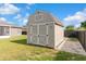 Backyard storage shed complete with double doors and a solid base for all your storage needs at 906 Highland Crest Cir, Lake Wales, FL 33853