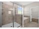 Bathroom features a tiled walk-in shower, soaking tub, and window with natural light at 9535 Beautiful Way, Winter Garden, FL 34787