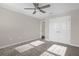 Bedroom featuring plush carpeting, closet, neutral paint, and ceiling fan at 9535 Beautiful Way, Winter Garden, FL 34787