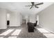 This spacious bonus room is carpeted and features a ceiling fan and desk area at 9535 Beautiful Way, Winter Garden, FL 34787