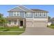 Charming two-story home with a well-manicured lawn and a spacious three-car garage at 9535 Beautiful Way, Winter Garden, FL 34787