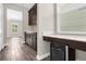 Butler's pantry complete with elegant dark cabinets, quartz counters, and a wine fridge at 9535 Beautiful Way, Winter Garden, FL 34787