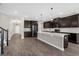 Open kitchen layout with stainless steel appliances and a spacious island at 9535 Beautiful Way, Winter Garden, FL 34787