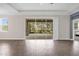 Bright living room showcases tile flooring and large sliding glass doors leading to the lanai at 9535 Beautiful Way, Winter Garden, FL 34787