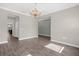 Spacious living room with wood-look tile flooring and seamless flow to other areas at 9535 Beautiful Way, Winter Garden, FL 34787