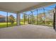 Large screened-in patio offers outdoor living and lovely green space at 9535 Beautiful Way, Winter Garden, FL 34787