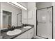 Modern bathroom featuring a walk-in shower with a glass door, dual sinks, and sleek fixtures for a spa-like experience at 956 Chula Ct, Lady Lake, FL 32159