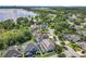 Stunning aerial view of homes with private pools nestled among lush greenery and a beautiful lakefront setting at 10319 Lavande Dr, Orlando, FL 32836