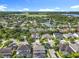Expansive aerial view of a neighborhood with mature trees, serene ponds, and well-manicured lawns at 10319 Lavande Dr, Orlando, FL 32836