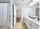 Bathroom with double sink vanity, shower, and tile floor at 10319 Lavande Dr, Orlando, FL 32836