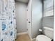 Bathroom with shower and tub combination, toilet, and small window at 10319 Lavande Dr, Orlando, FL 32836