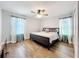 Bedroom features a ceiling fan, two windows and hardwood floors at 10319 Lavande Dr, Orlando, FL 32836