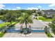 Community entrance with a blue gate and paved road leading to beautiful homes at 10319 Lavande Dr, Orlando, FL 32836