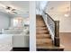 Open-concept design showcasing the stairs, living room, and other common areas at 10319 Lavande Dr, Orlando, FL 32836