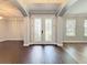 Bright foyer with decorative front doors and wood floors at 10319 Lavande Dr, Orlando, FL 32836