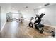 Spacious game room area featuring a ping pong table and exercise equipment at 10319 Lavande Dr, Orlando, FL 32836