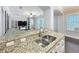 Kitchen view showcases granite countertops, stainless steel sink, and an open-concept layout at 10319 Lavande Dr, Orlando, FL 32836