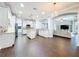 Open kitchen with large island, stainless appliances, and wood flooring at 10319 Lavande Dr, Orlando, FL 32836