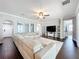 Open living room featuring dark floors, a ceiling fan, and sliding glass doors at 10319 Lavande Dr, Orlando, FL 32836