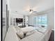 Modern living room with plush seating, open layout, and sliding glass doors to the pool at 10319 Lavande Dr, Orlando, FL 32836