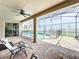 Outdoor seating area by the pool with a covered patio and ceiling fan at 10319 Lavande Dr, Orlando, FL 32836