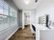 Vanity area with lighted make-up mirror, wooden floors, and natural light at 10319 Lavande Dr, Orlando, FL 32836