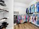 Walk-in closet with ample shelving and hanging space for clothes and shoes at 10319 Lavande Dr, Orlando, FL 32836