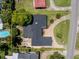A beautiful home with a paved drive, dark roof, patio with a fire pit, and an outlined border at 105 John Anderson Dr, Ormond Beach, FL 32176