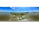 Panoramic aerial view of the waterfront community offering docks and stunning ocean views at 105 John Anderson Dr, Ormond Beach, FL 32176