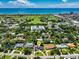 Stunning aerial shot of a beautiful home near a golf course and the ocean at 105 John Anderson Dr, Ormond Beach, FL 32176