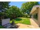 Grassy backyard featuring lush landscaping, trees, and greenery at 105 John Anderson Dr, Ormond Beach, FL 32176