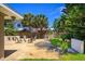 Backyard patio with a fire pit, chairs, and fenced yard at 105 John Anderson Dr, Ormond Beach, FL 32176