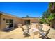Backyard patio area with fire pit, built-in features, and chairs at 105 John Anderson Dr, Ormond Beach, FL 32176