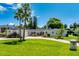 Charming single-story home with a lush green lawn, brick driveway, and manicured landscaping at 105 John Anderson Dr, Ormond Beach, FL 32176