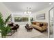 Inviting living room featuring stylish furniture, natural light, and a serene atmosphere with tile flooring at 105 John Anderson Dr, Ormond Beach, FL 32176